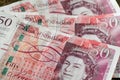 Close up view of three fifty pound banknotes from the Bank of England