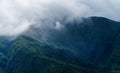 Close up of Fansipan mountain hills valley with forest and fog cloud at sunset. Panoramic view at Sapa, Vietnam. Natural landscape