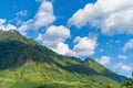 Close up of Fansipan mountain hills valley with forest trees at noon. Panoramic view at Sapa, Vietnam. Natural landscape