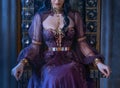 Close-up fantasy portrait woman queen sits on antique royal throne. No face. Beautiful vintage majestic luxury medieval Royalty Free Stock Photo