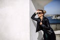 Close up fashion ;luxury portrait of stunning woman, full perfect lips and face, sunny day sunglasses and leather jacket, big Royalty Free Stock Photo