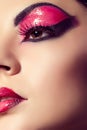 Close up fashion model portrait. Scarlet makeup. Black arrows. Royalty Free Stock Photo