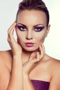 Close up fashion portrait. Model shooting. Purple makeup. Royalty Free Stock Photo