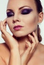 Close up fashion portrait. Model shooting. Purple makeup. Royalty Free Stock Photo