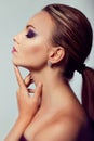 Close up fashion portrait. Model shooting. Purple makeup. Royalty Free Stock Photo