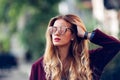 Close up fashion street stile portrait of pretty girl in fall casual outfit Beautiful blond posing outdoor.