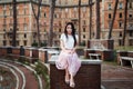 Close-up Fashion woman portrait of young pretty trendy girl posing at the city in Europe, summer street fashion Royalty Free Stock Photo