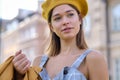 Close-up Fashion woman portrait of young pretty trendy girl posing at the city in Europe,summer street fashion, yellow beret , Royalty Free Stock Photo