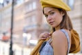 Close-up Fashion woman portrait of young pretty trendy girl posing at the city in Europe,summer street fashion, yellow beret ,