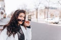 Close-up Fashion woman portrait of young pretty trendy girl posing at the city, spring street fashion. laughing and Royalty Free Stock Photo