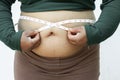 Close-up of fat woman on white background. Concept for obesity issue, diet of food for health Royalty Free Stock Photo