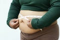 Close-up of fat woman on white background. Concept for obesity issue, diet of food for health Royalty Free Stock Photo