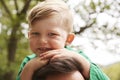 Close Up Of Father Carrying Son On Shoulders On Walk By River Royalty Free Stock Photo