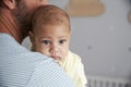 Close Up Of Father Comforting Newborn Baby Son In Nursery Royalty Free Stock Photo