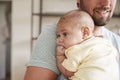 Close Up Of Father Comforting Newborn Baby Son In Nursery Royalty Free Stock Photo