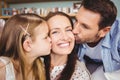 Close-up of father and daughter kissing mother Royalty Free Stock Photo