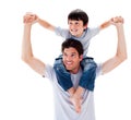 Close-up of father giving his son piggyback ride Royalty Free Stock Photo