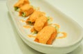 Close up favorite salmon asparagus roll with spicy sauce