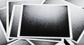 Monochrome dotted fade pattern on vintage photo stack Royalty Free Stock Photo