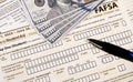 Close up of federal financial aid application with US Cash Royalty Free Stock Photo