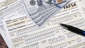 Close up of federal financial aid application with US Cash Royalty Free Stock Photo