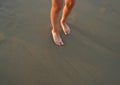 Close-up of the feet of family on the white sandy beach Royalty Free Stock Photo