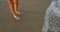 Close-up of the feet of family on the white sandy beach Royalty Free Stock Photo