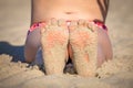 Girls feet on the beach Royalty Free Stock Photo