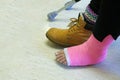 Close up of foot with pink fibreglass cast.