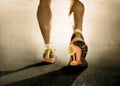 Close up feet running shoes and strong athletic legs sport man jogging fitness training workout Royalty Free Stock Photo