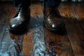 close-up of feet in shoes on a dirty floor Royalty Free Stock Photo