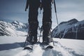 Close up on a female adventurer's boot, ski and binding during ski touring in the mountains