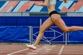close-up female athlete finishing sprint race at stadium