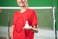 Close up of female badminton player holding racket and shuttlecock Royalty Free Stock Photo