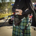 Close up of female bag piper holding bagpipes Royalty Free Stock Photo