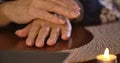 Close-up of female Caucasian hands touching cards lying at the table. Cartomancy, clairvoyance, fortune telling