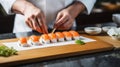 Close-up of female chef making sushi rolls in restaurant kitchen. Generative AI Royalty Free Stock Photo