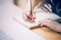 Close up of female designer hands at workplace drawing something