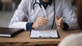 Close up of female doctor consult patient in hospital Royalty Free Stock Photo