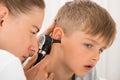 Doctor Examining Boy`s Ear Royalty Free Stock Photo