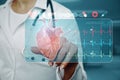 Close up of female doctor hand pointing at creative glowing medical cardiology interface on blurry hospital background. Hi-tech Royalty Free Stock Photo