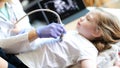 Doctor making diagnostic examination of internal organs in children using ultrasound machine. Royalty Free Stock Photo