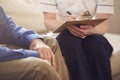 Close Up Of Female Doctor Making Notes During Home Visit To Senior Man For Medical Check Royalty Free Stock Photo