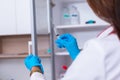 Close up of a female doctor  nurse  holding a syringe while standing in a medical office Royalty Free Stock Photo