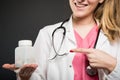 Close-up of female doctor pointing bottle of pills Royalty Free Stock Photo