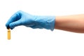 Close up of female doctor's hand in blue sterilized surgical glove holding transparent brown glass ampoule with a drug Royalty Free Stock Photo