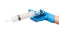 Close up of female doctor's hand in blue sterilized surgical glove with large plastic medical syringe for purging ears Royalty Free Stock Photo