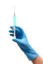 Close up of female doctor's hand in blue sterilized surgical glove with plastic medical syringe filled with blue drug Royalty Free Stock Photo