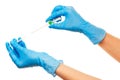 Close up of female doctor's hands in blue sterilized surgical gloves with green plastic catheter against white