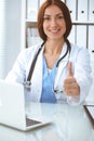 Close up of female doctor thumbs up. Happy cheerful smiling brunette physician ready to examine patient. Medicine Royalty Free Stock Photo